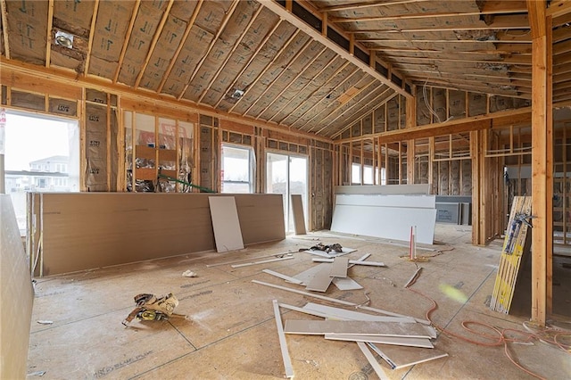 miscellaneous room featuring high vaulted ceiling and a wealth of natural light