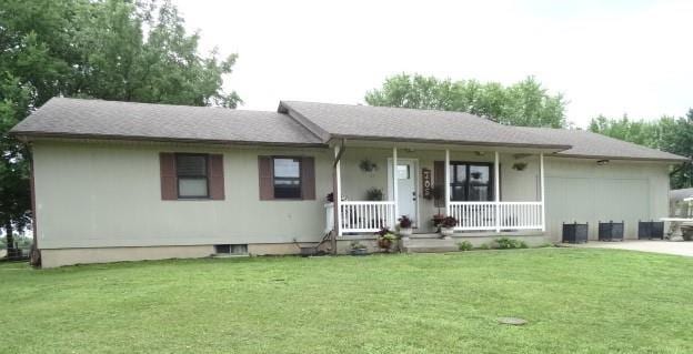 ranch-style house with a porch and a front yard