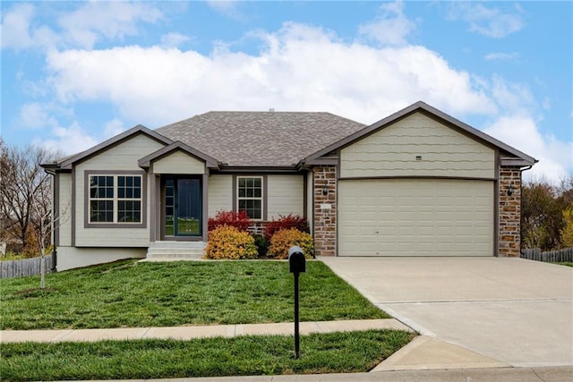 single story home featuring a front lawn and a garage