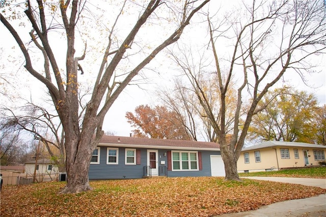 ranch-style house featuring a garage