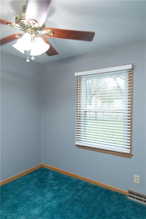 carpeted empty room with ceiling fan