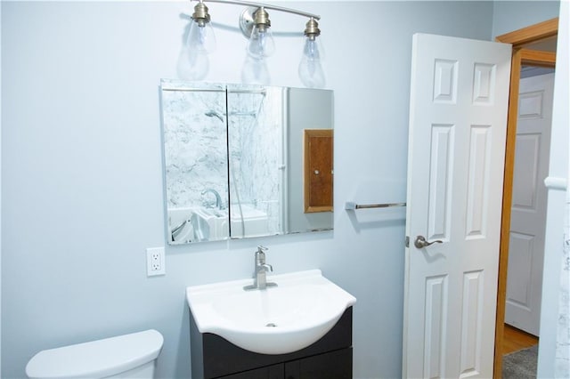 bathroom with vanity and toilet