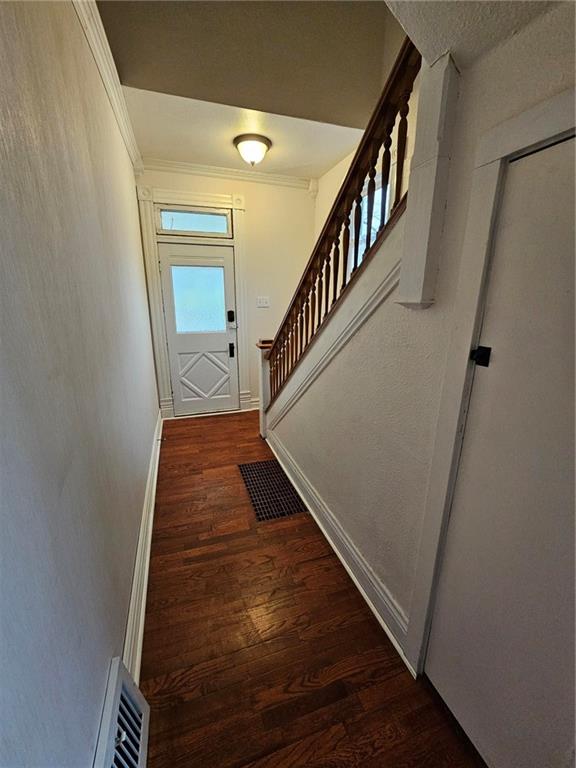 doorway featuring dark hardwood / wood-style floors