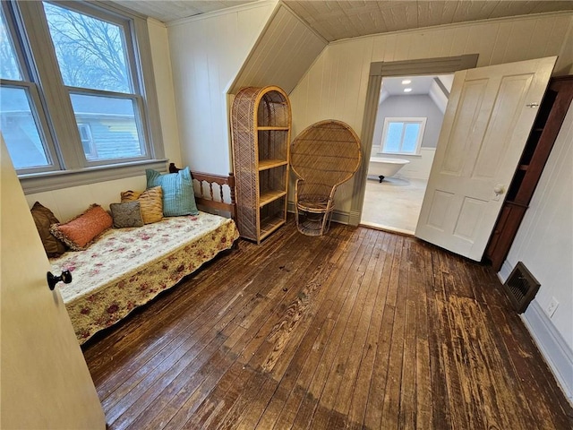 living area with dark hardwood / wood-style floors and vaulted ceiling