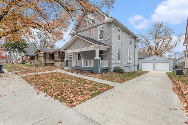 view of front of property with a porch, central AC, a garage, and an outdoor structure