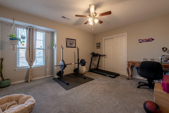 workout room featuring ceiling fan and carpet floors