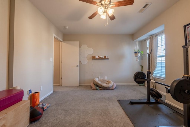 exercise area with carpet flooring and ceiling fan