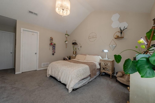 carpeted bedroom featuring a chandelier and vaulted ceiling