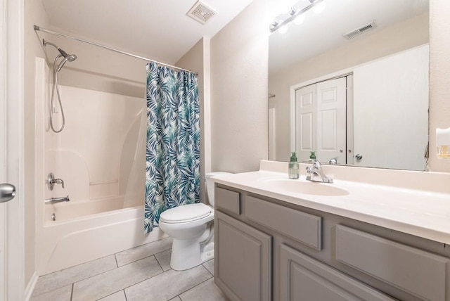 full bathroom with tile patterned floors, vanity, shower / tub combo, and toilet