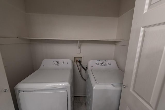 washroom with independent washer and dryer