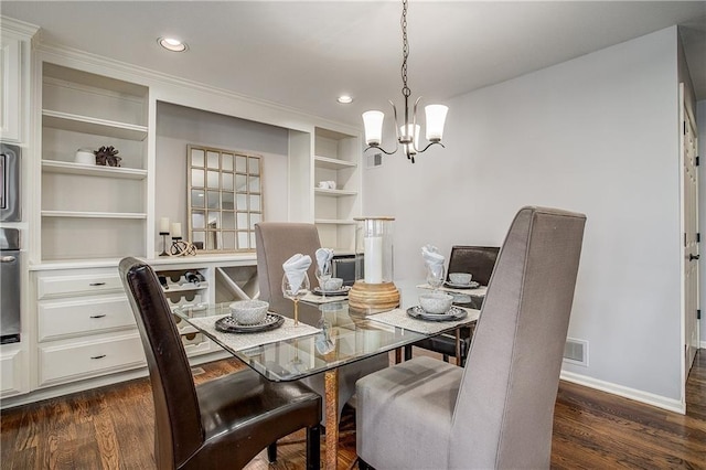 dining room featuring dark hardwood / wood-style floors and a notable chandelier