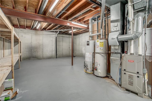 basement featuring heating unit and water heater