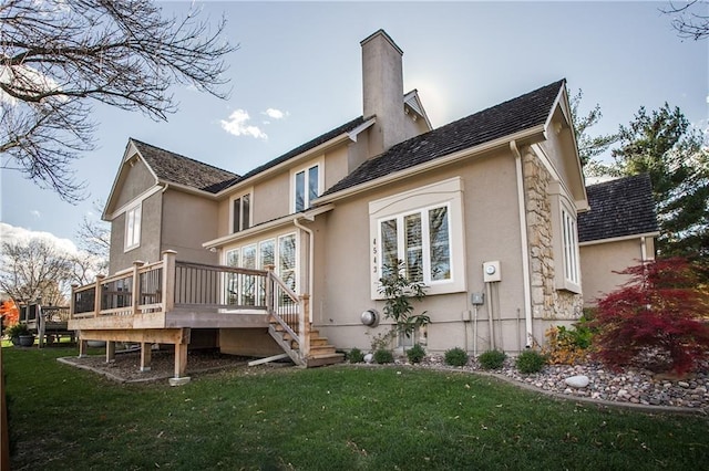 back of house with a yard and a deck