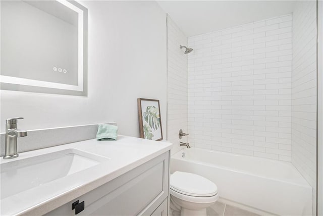 full bathroom featuring vanity, toilet, and tiled shower / bath combo