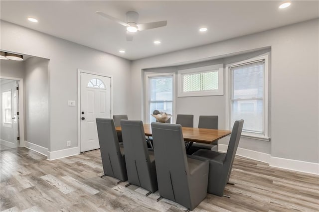 dining room with light wood-type flooring and ceiling fan