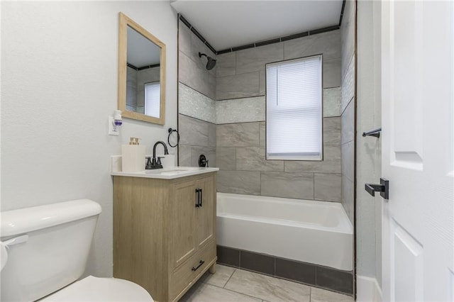 full bathroom with tile patterned floors, vanity, toilet, and tiled shower / bath