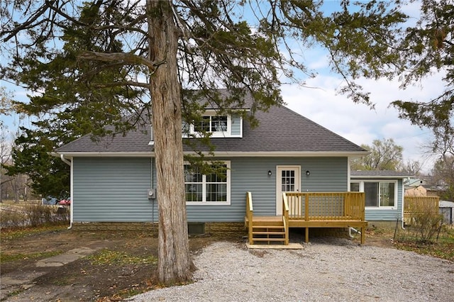 rear view of house featuring a deck