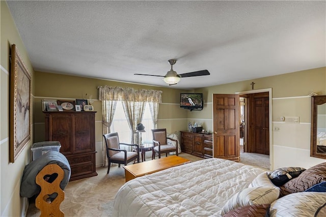 401 Taylor Rd, Independence, KS 67301 - bedroom with light colored carpet, a textured ceiling, and a ceiling fan