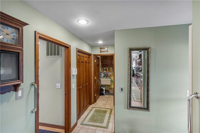 401 Taylor Rd, Independence, KS 67301 - hallway with a textured ceiling and recessed lighting