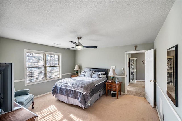 401 Taylor Rd, Independence, KS 67301 - bedroom featuring light carpet, a textured ceiling, ceiling fan, and baseboards