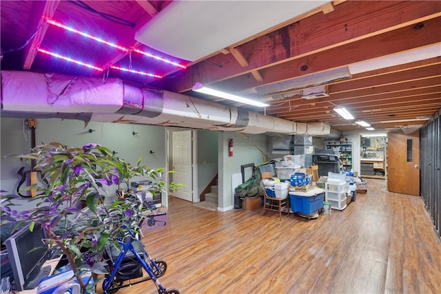 401 Taylor Rd, Independence, KS 67301 - below grade area featuring wood finished floors and stairway