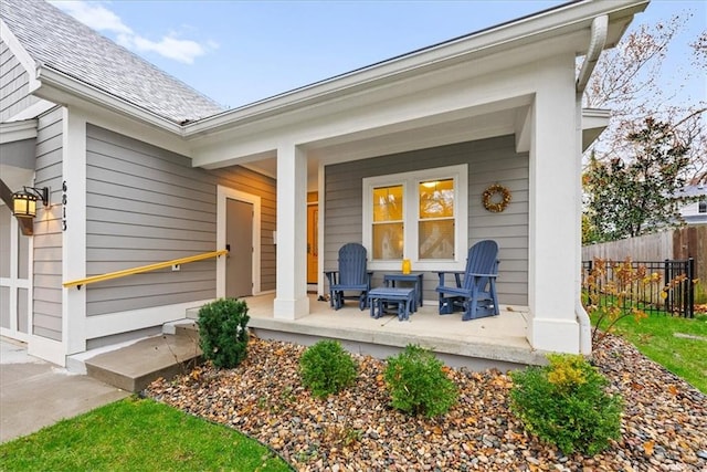 view of exterior entry with a porch