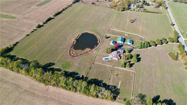 aerial view with a rural view and a water view