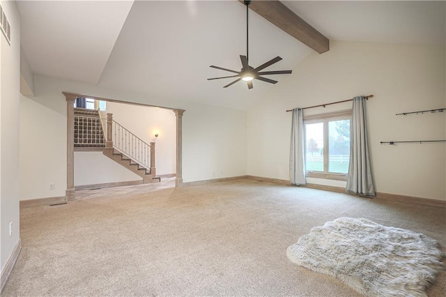 unfurnished living room with carpet flooring, ceiling fan, beam ceiling, and high vaulted ceiling