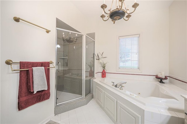 bathroom with tile patterned flooring, shower with separate bathtub, and a chandelier