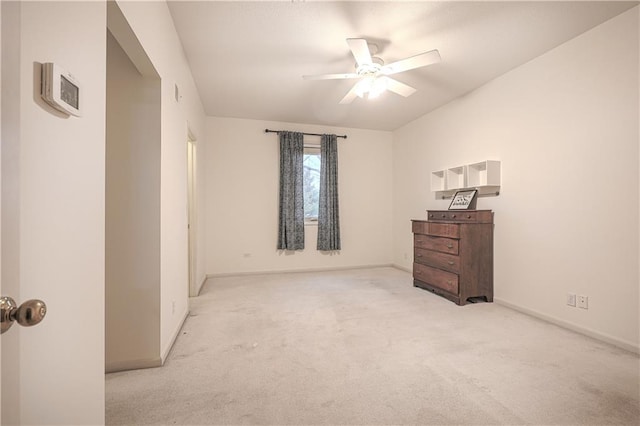 bedroom featuring light carpet and ceiling fan