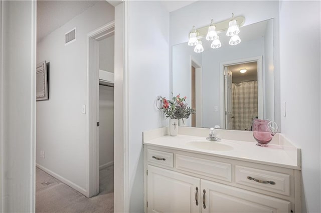 bathroom with a shower with curtain and vanity