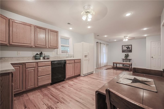 kitchen featuring dishwasher, white refrigerator with ice dispenser, sink, light hardwood / wood-style flooring, and ceiling fan