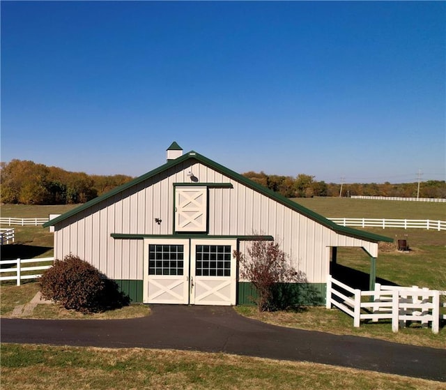 view of outbuilding featuring a rural view