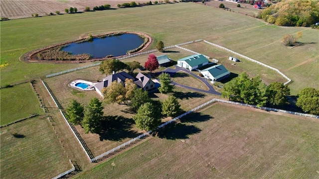 aerial view with a rural view and a water view