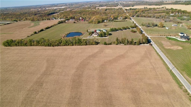 aerial view featuring a rural view and a water view