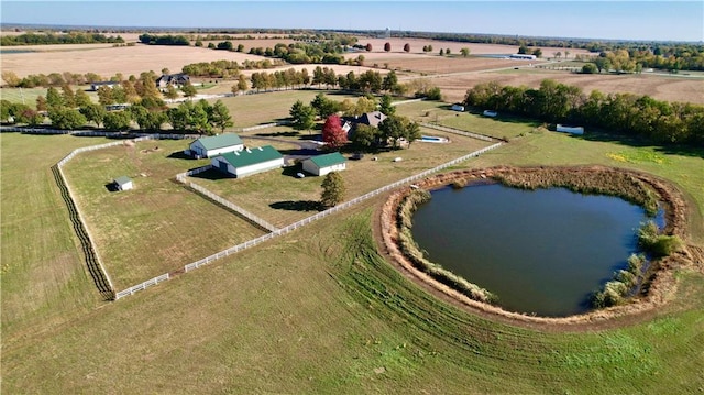 birds eye view of property with a rural view and a water view