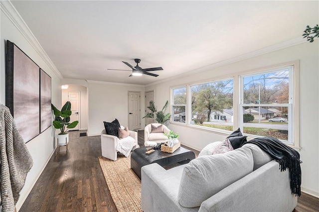 living room featuring ceiling fan, dark hardwood / wood-style flooring, and ornamental molding