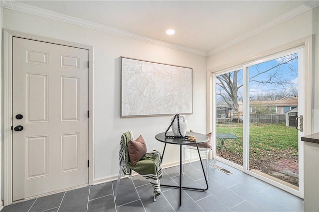 interior space featuring ornamental molding and a wealth of natural light