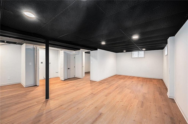 basement featuring light hardwood / wood-style floors