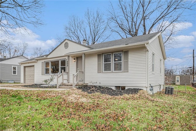 view of front of home featuring a garage and a front lawn