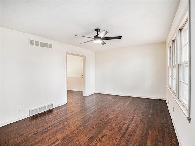 unfurnished room with dark hardwood / wood-style flooring and ceiling fan