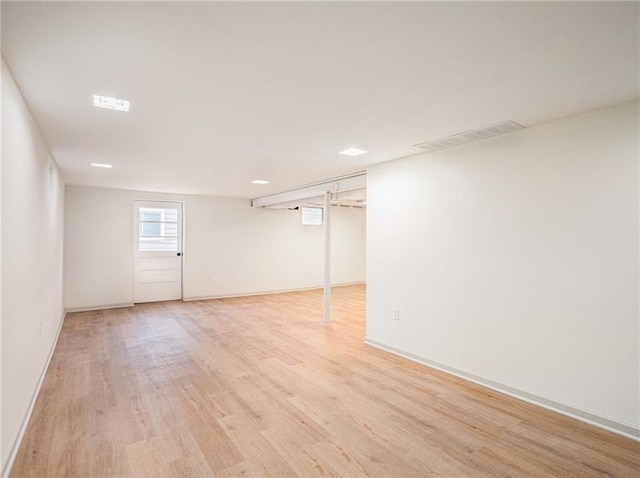 basement featuring light wood-type flooring