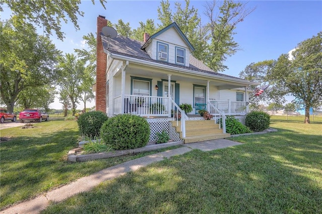 view of front facade with a front lawn and covered porch