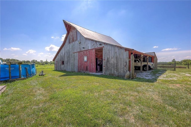 view of outdoor structure featuring a lawn