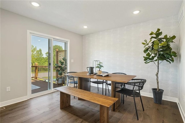 dining area with dark wood-type flooring