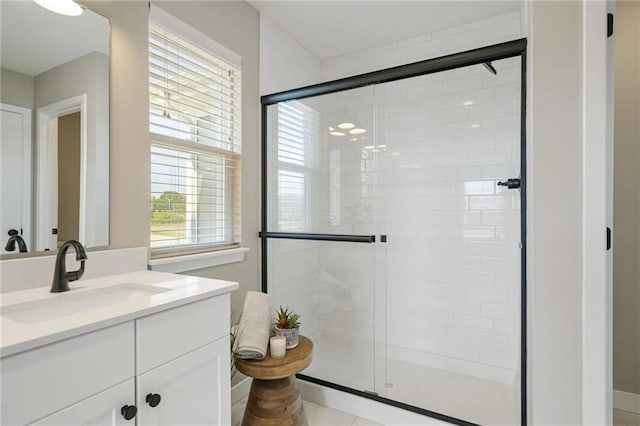 bathroom featuring vanity and walk in shower