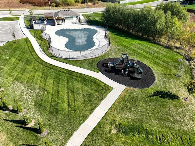 view of pool featuring a playground and a yard