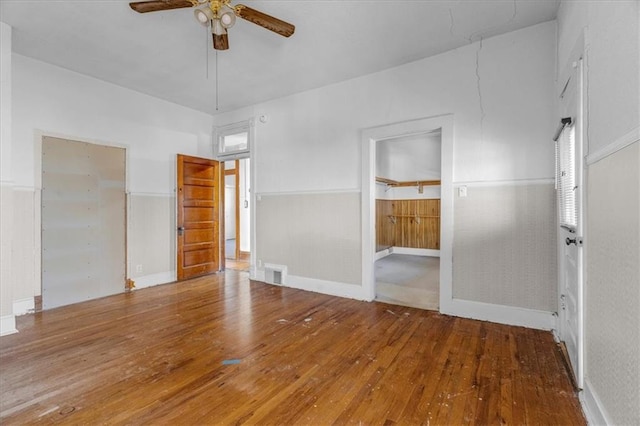 spare room with ceiling fan and wood-type flooring