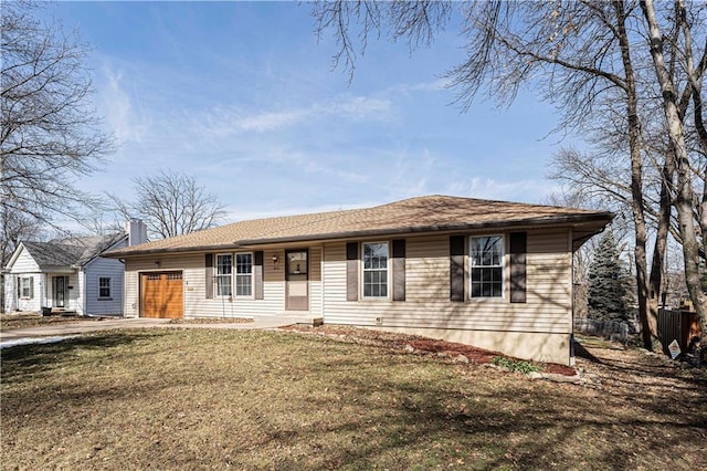 ranch-style house featuring driveway, an attached garage, fence, and a front yard