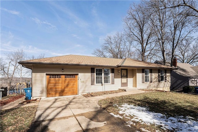 ranch-style house featuring an attached garage and driveway